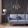 Real photo of dark living room interior with glass lamp, floral JUPITER OCEAN BLUE